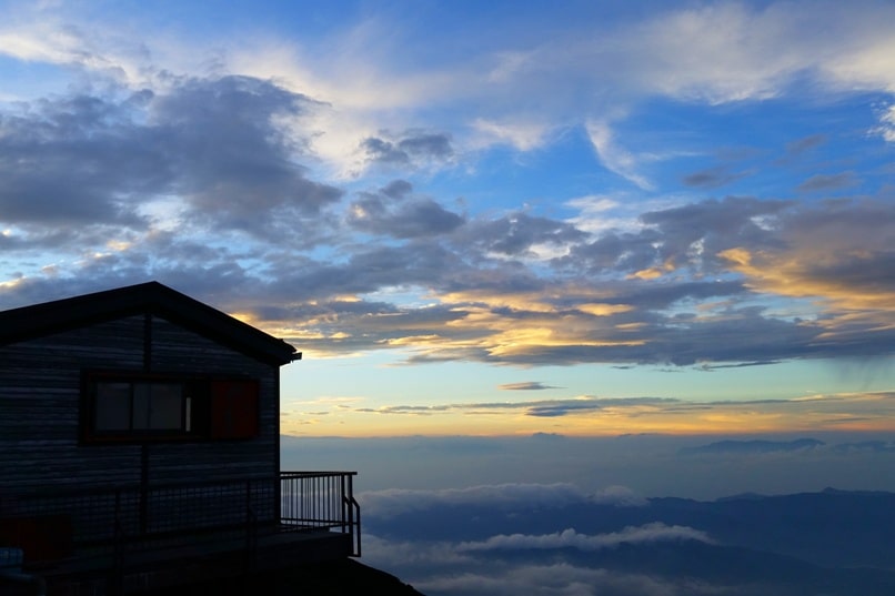 Mt Fuji mountain huts - sunset at 7th station mountain hut. Climbing Mount Fuji. Hiking in Japan.