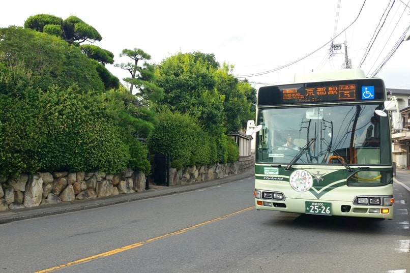 Getting around Kyoto by bus. kyoto city bus green. Backpacking Japan travel blog