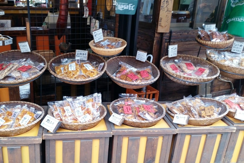 Nawate Street in Matsumoto for Japanese street food snacks in Japan - senbei rice crackers. Backpacking japan travel blog